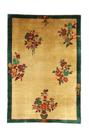 Antique Chinese Art Deco rug, 105x72 inches, handwoven wool from the 1920s–1930s, featuring delicate floral motifs in beige and green tones.
